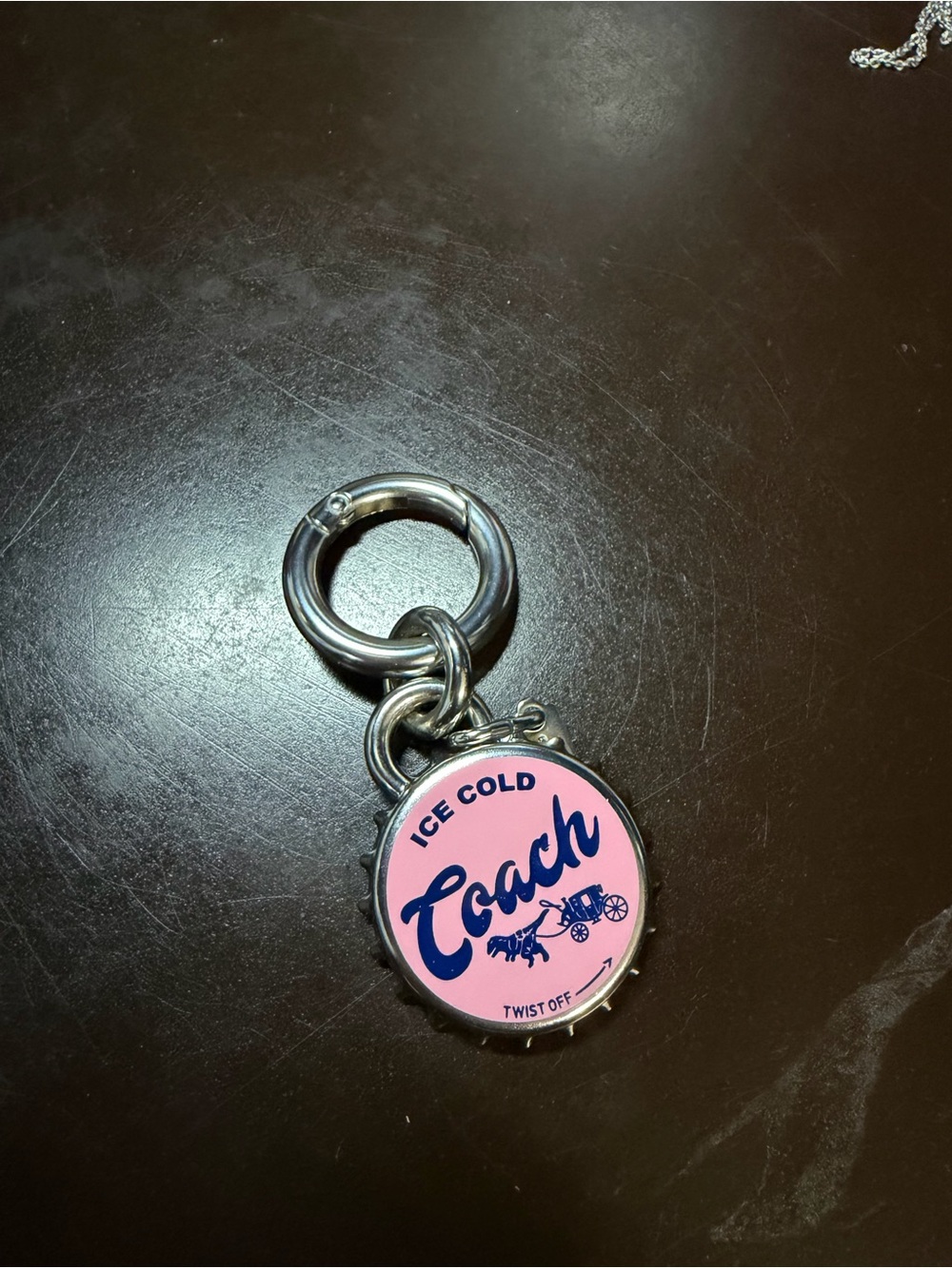 Coach Pink Enamel Logo Bottle Cap Keychain with Silver Hardware